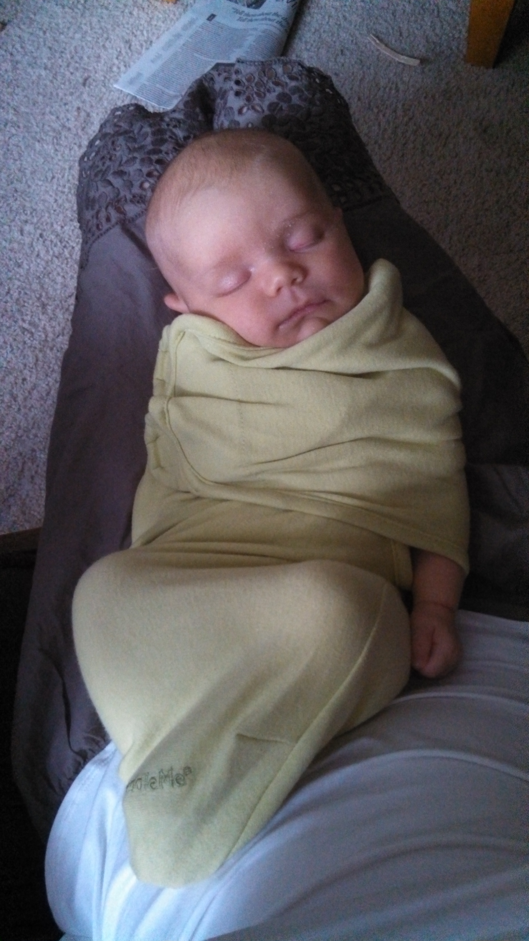 Our tiny caterpillar is expert at sneaking an arm out of her snuggly swaddler. 