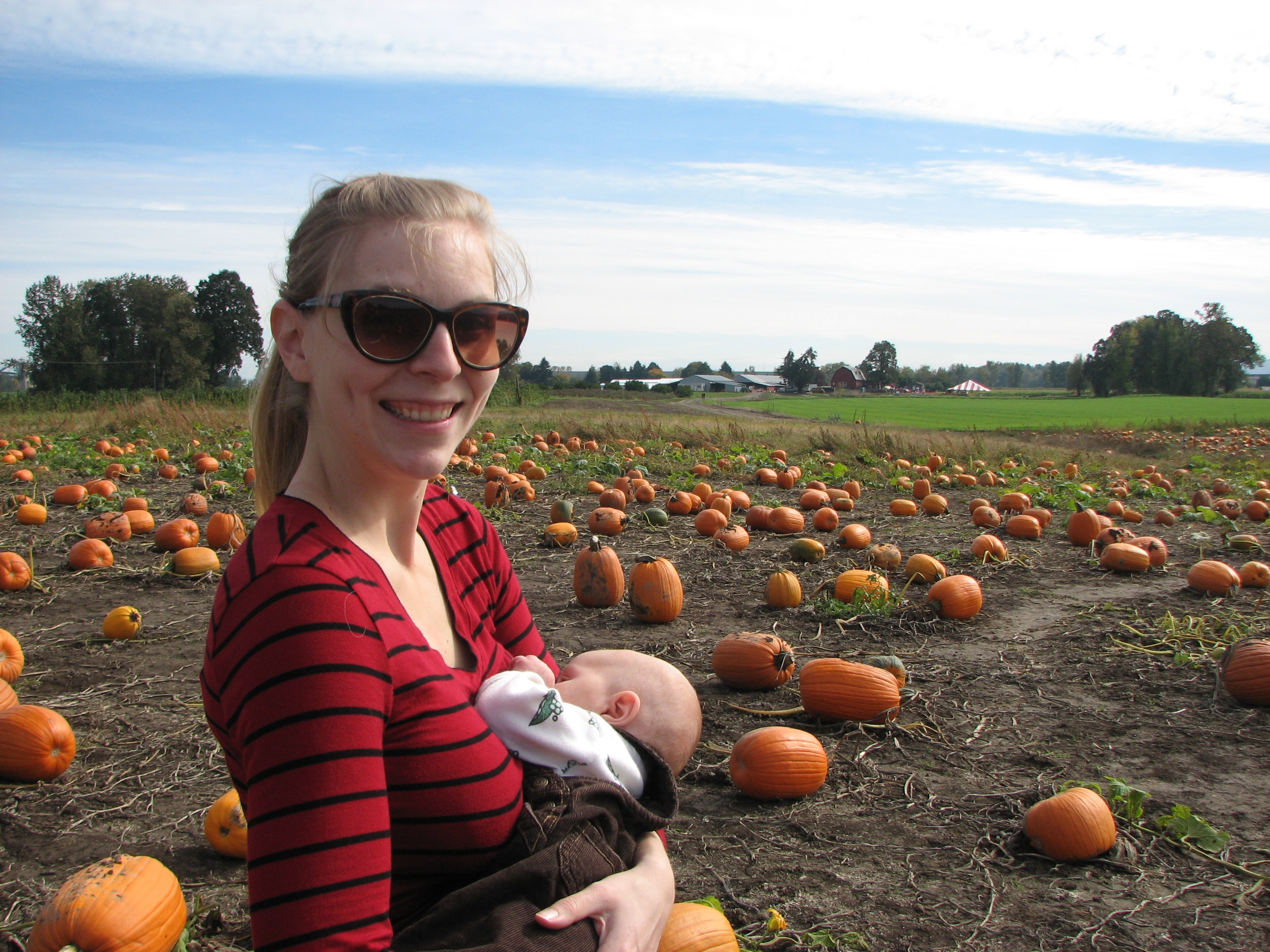 A baby's hunger waits for no one, so you gotta feed her where you can—even the pumpkin patch.