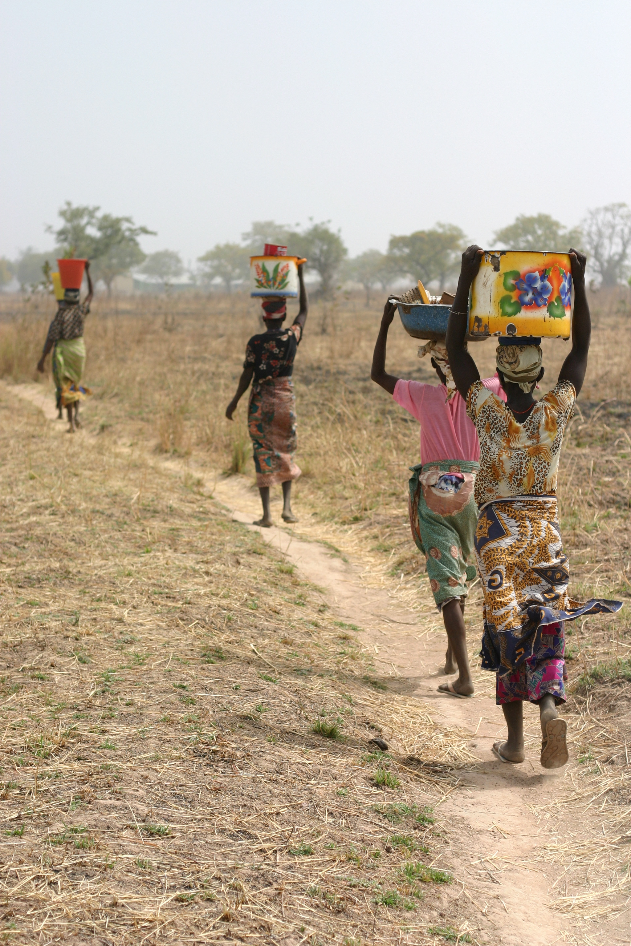 Women in Northern Ghana carry the responsibility of fetching water for household chores. Credit: Catherine Ryan Gregory