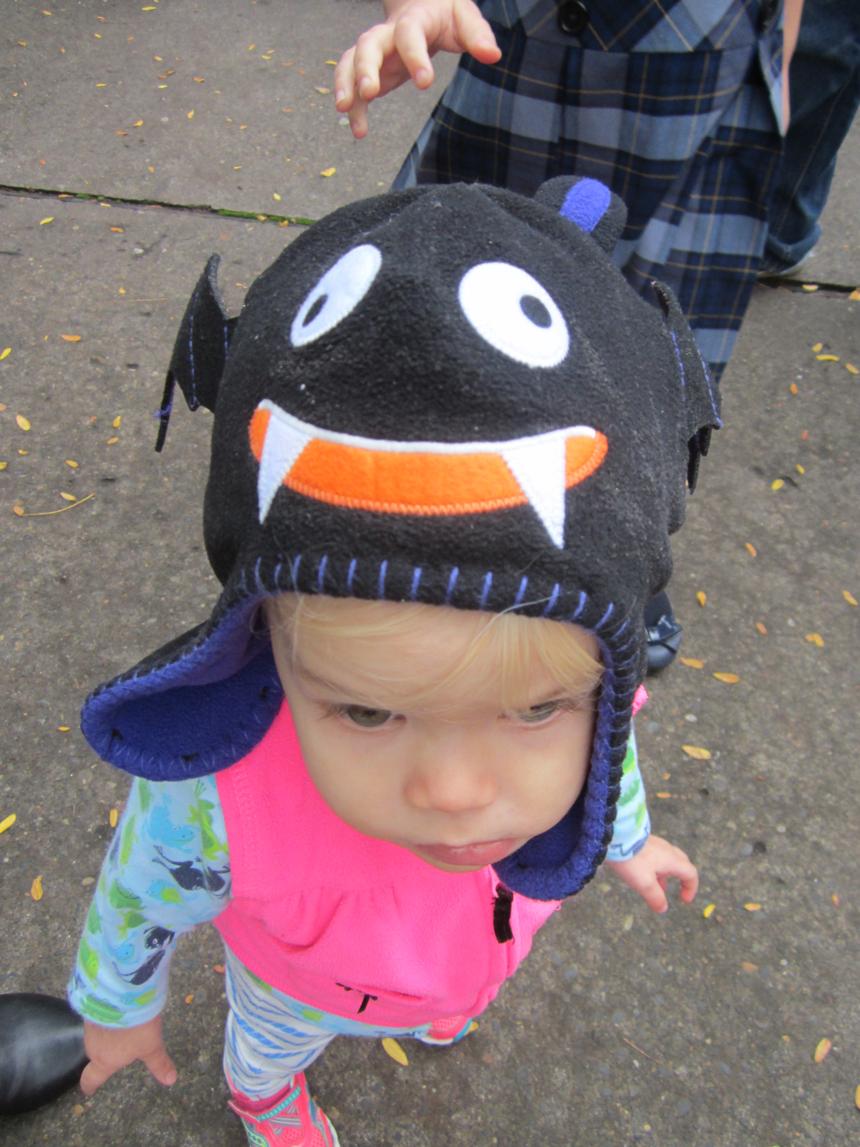 Some random kid at the zoo couldn't stop touching Peeper's bat hat. I don't blame her—it's irresistible!